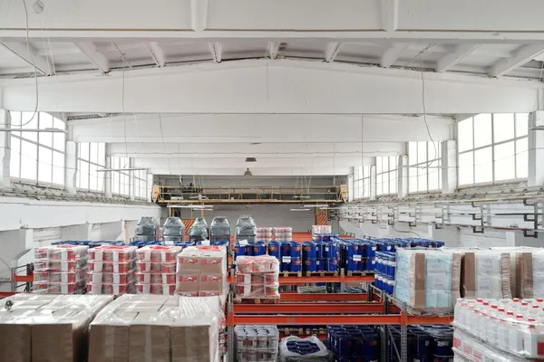Warehouse shelving holding larger volumes of packaged inventory