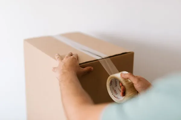 A parcel being sealed ready for dispatch